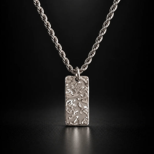 silver hammered rectangle necklace black background hero