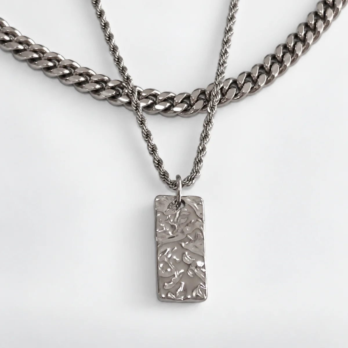 silver hammered rectangle necklace layered set white background