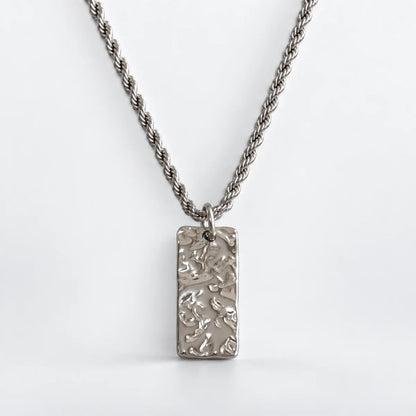 silver hammered rectangle necklace with rope chain white background