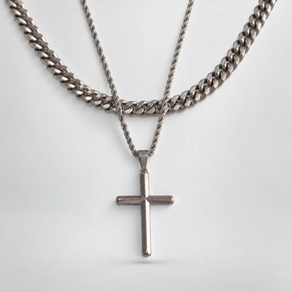 silver minimalist cross necklace layered set white background