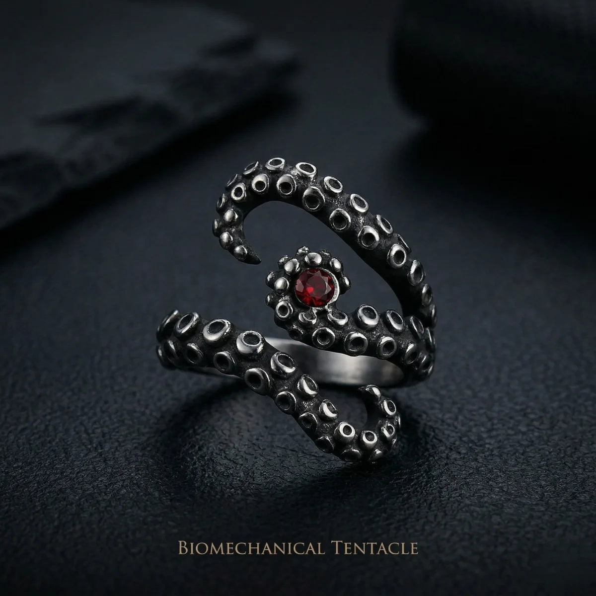 Silver Octopus Tentacle Ring on dark slate background