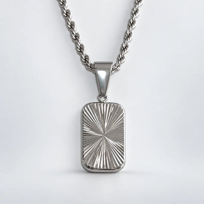 sunburst dog tag necklace with rope chain white background