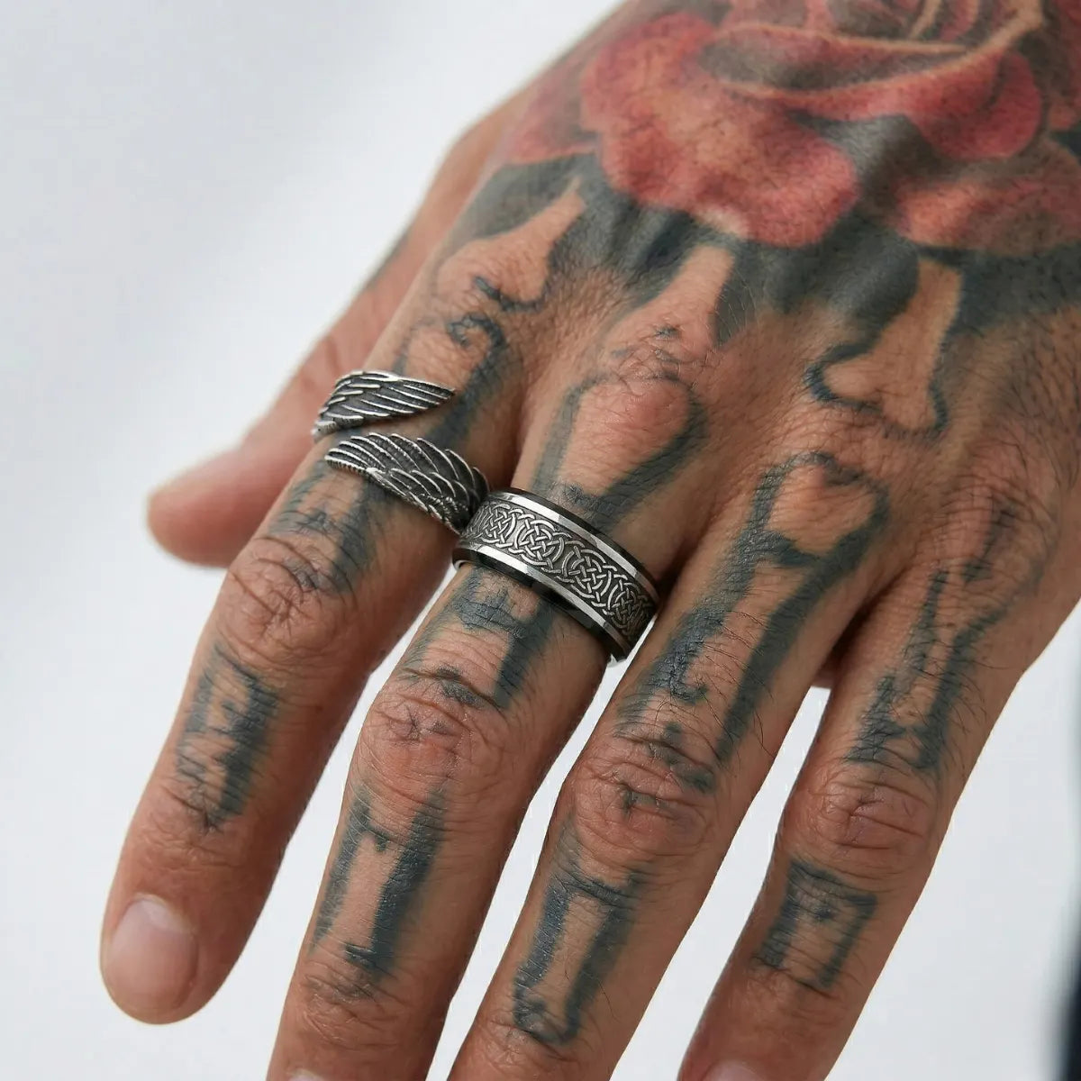 Tattooed Hand Wearing Angel Wing Ring Index Finger Mens Biker Jewelry