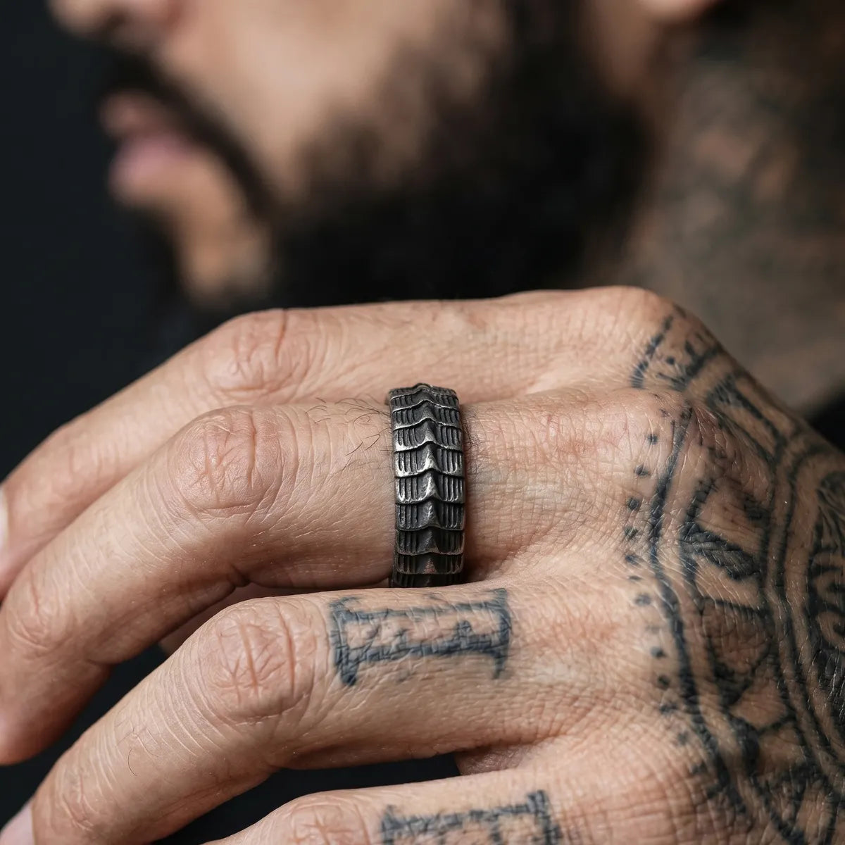 Tattooed Man Wearing Serpent Spine Ring Alternative Biker Accessories