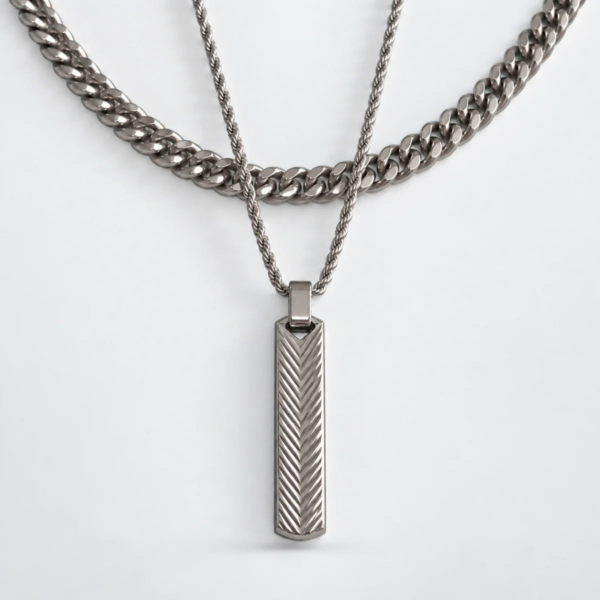 textured vertical bar necklace layered set white background