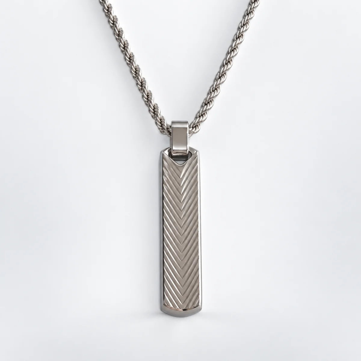 textured vertical bar necklace with rope chain white background