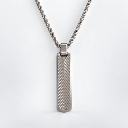 textured vertical bar necklace with rope chain white background