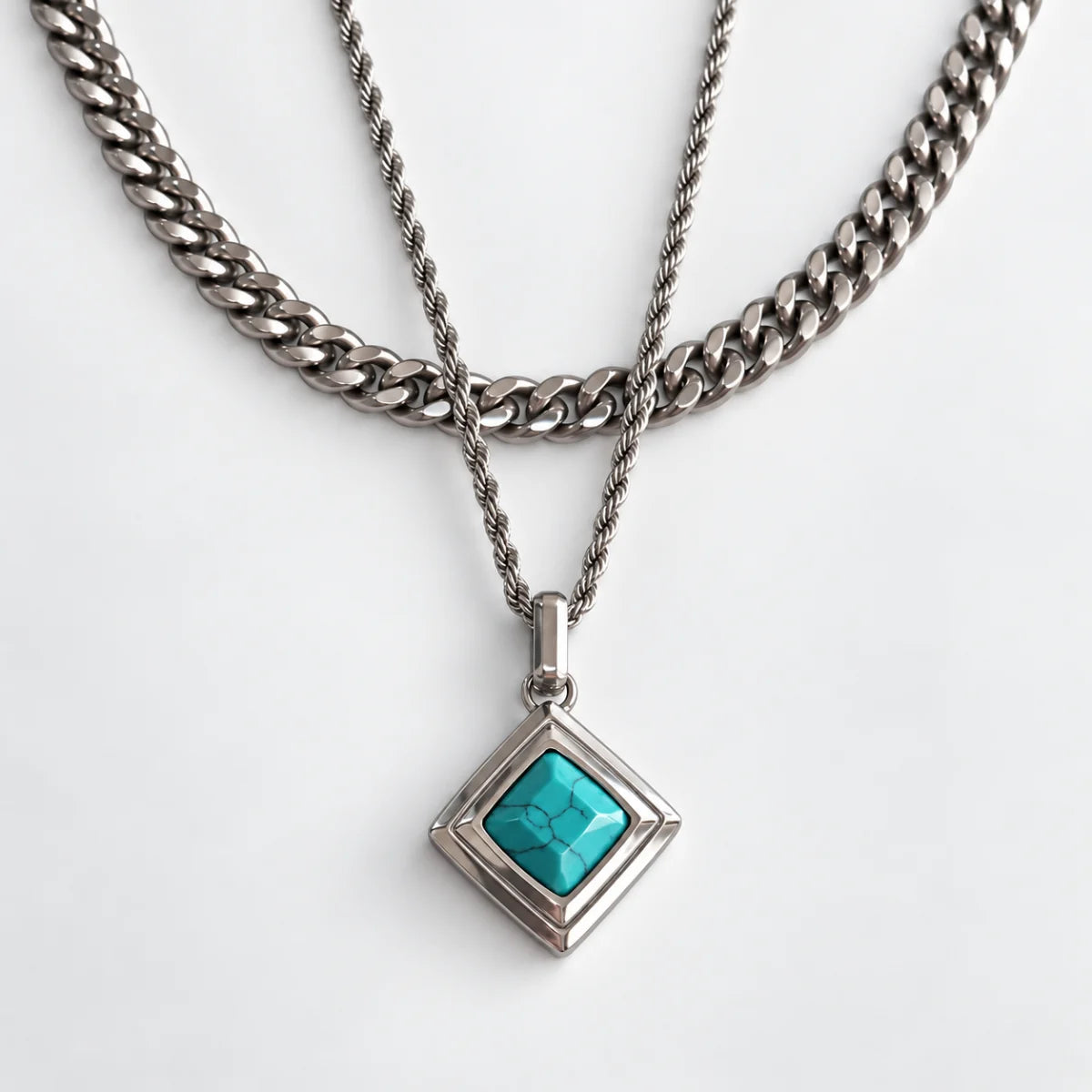 turquoise geometric necklace layered set white background