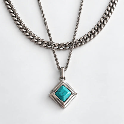 turquoise geometric necklace layered set white background