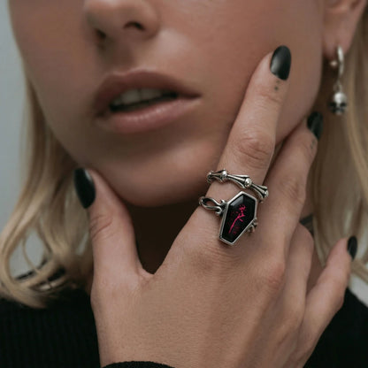 Woman Wearing Bone Link Ring Stacked With Coffin Ring Witchy Jewelry