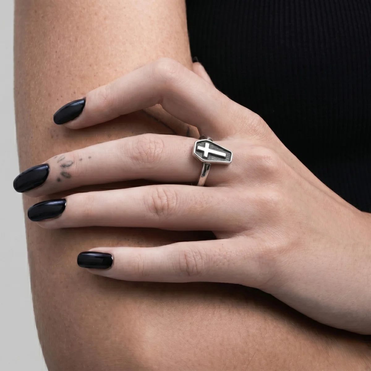 Woman Wearing Minimalist Cross Coffin Ring Black Nails Dark Aesthetic Jewelry